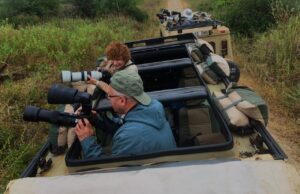 Wildlife photographers on a safari jeep