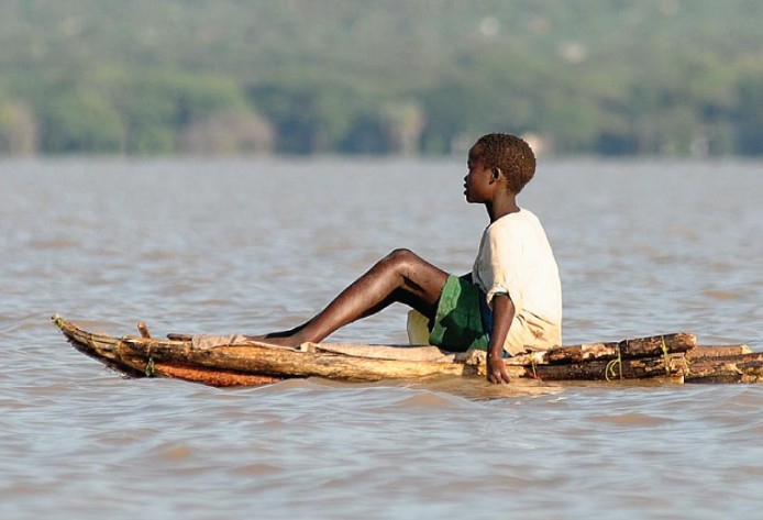 Child on a boat in Lake Baringo